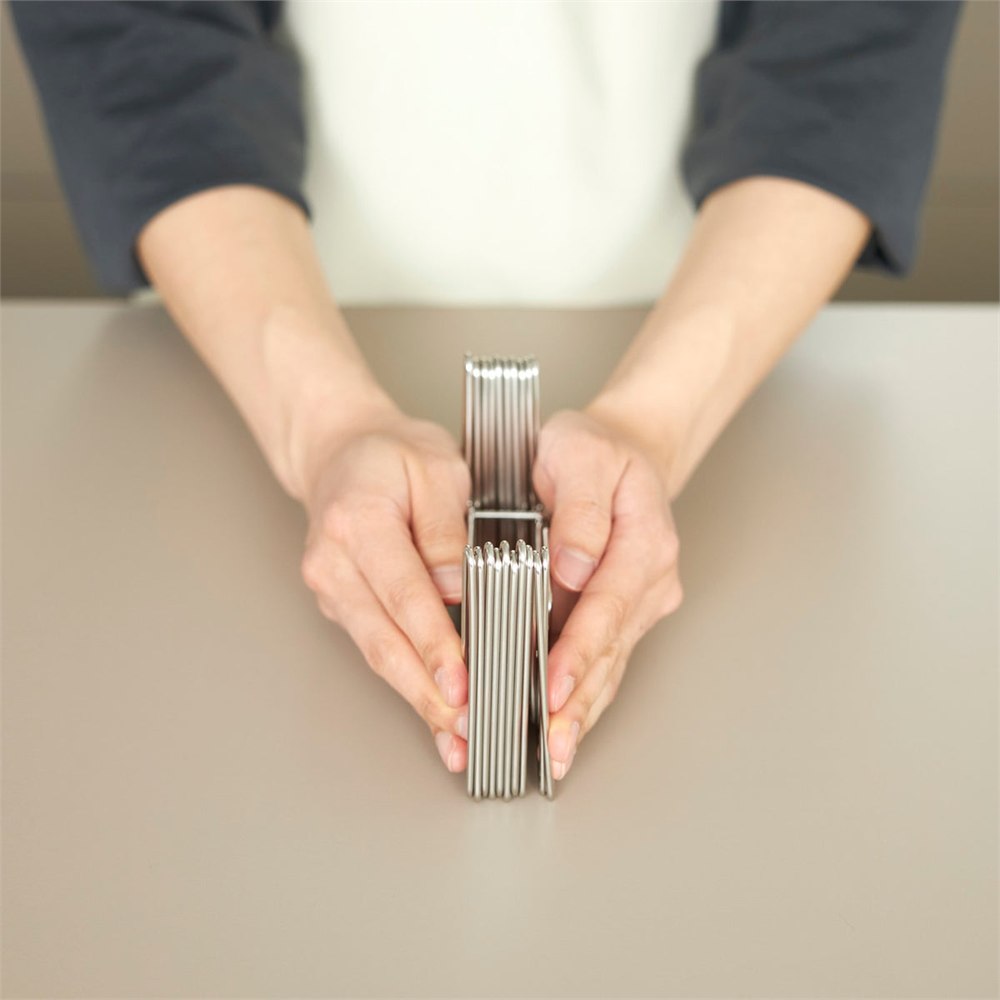 Slim Fold Dish Rack shown collapsed into a compact flat bundle