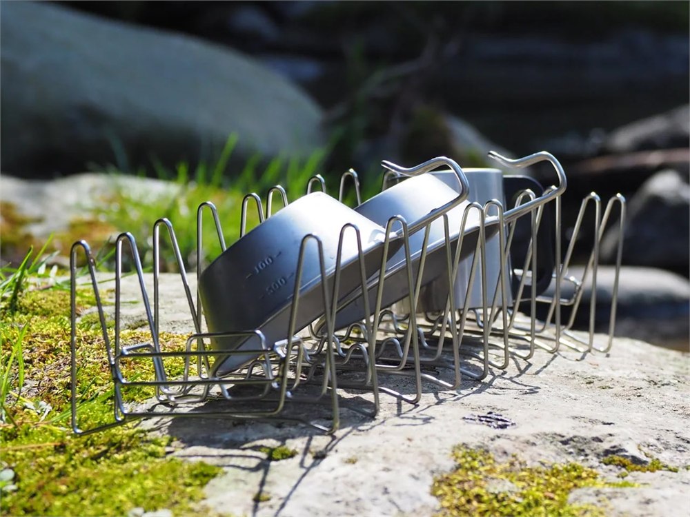 Slim Fold Dish Rack holding cups and dishes on a compact drying surface
