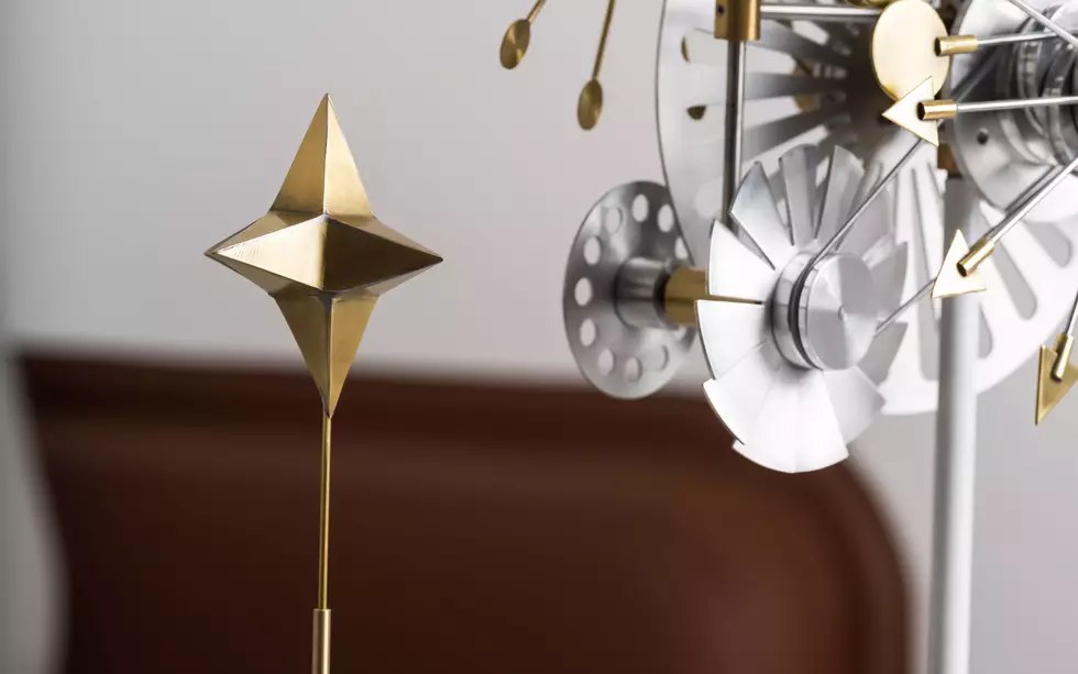 Close-up of brass star and metallic wheel details on the Solar Orbiter watch winder
