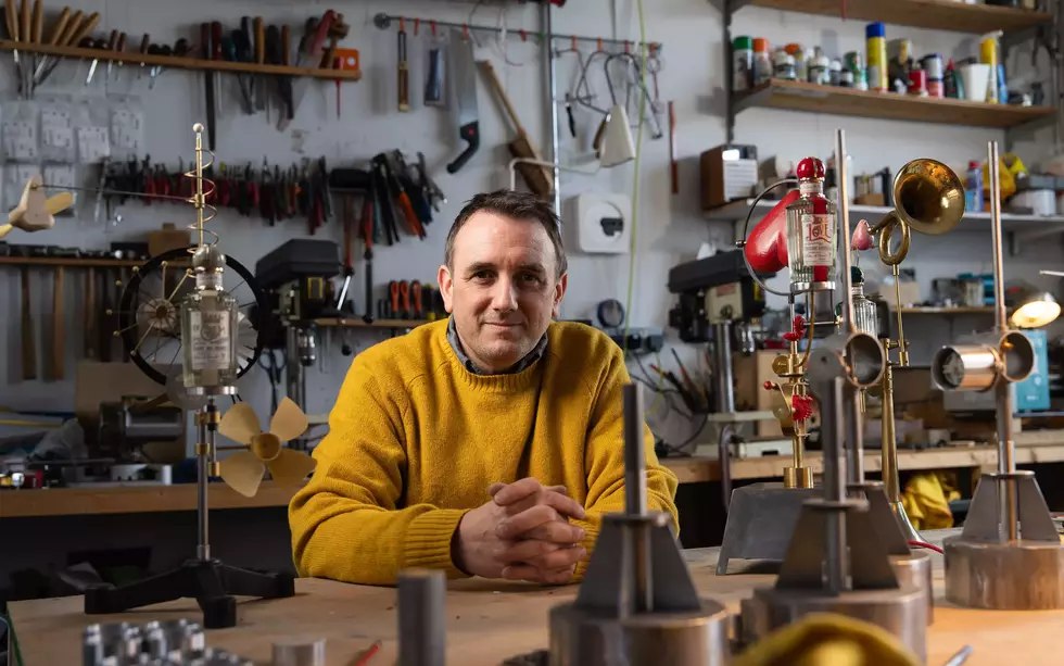 Martin Smith in the workshop with kinetic mechanical art pieces