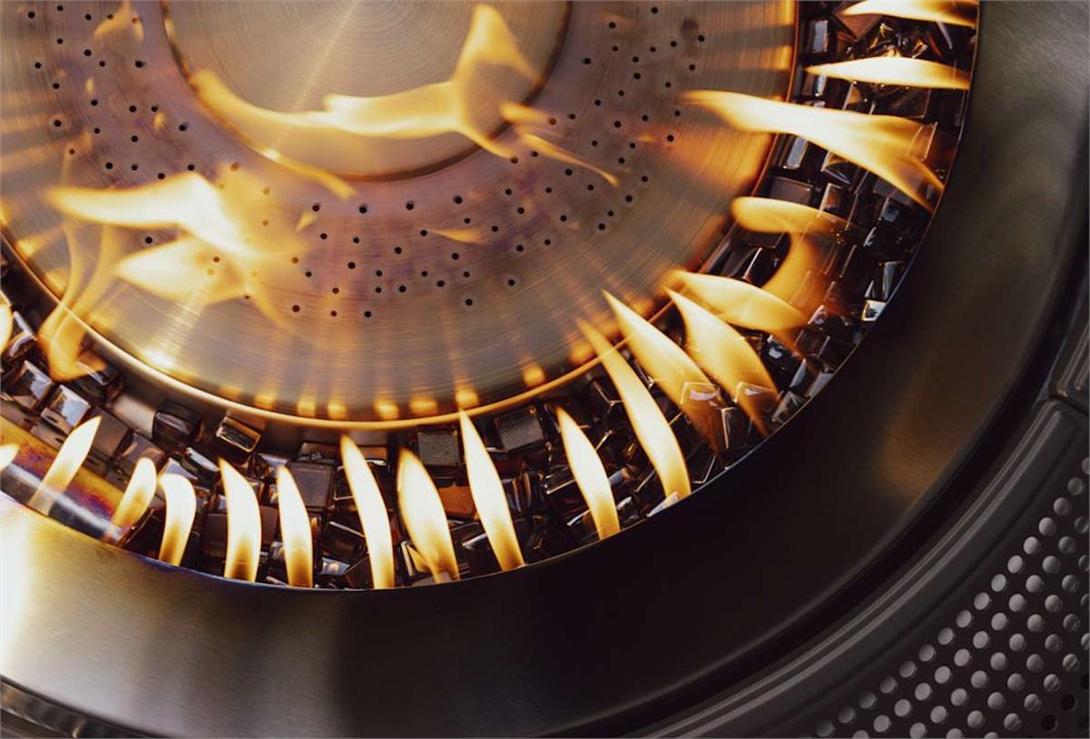 Close-up of the Infinity Flame dual-burner flame pattern inside the fire pit