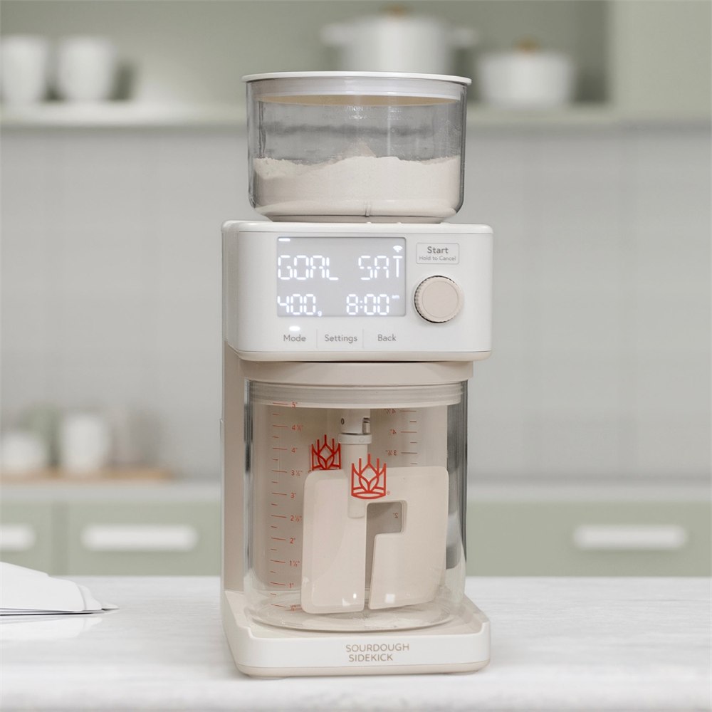 Sourdough Sidekick automatic starter feeder on a kitchen counter