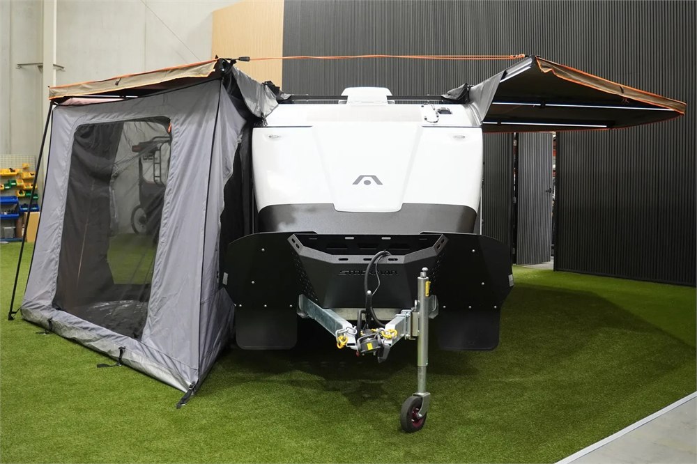 Stockman Rover front view with clipped-on change room and awnings