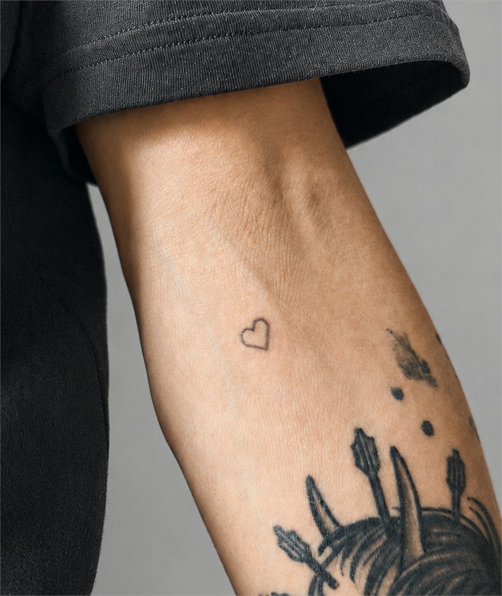 A close view of a small Microdot Tattoo patch and skin application area
