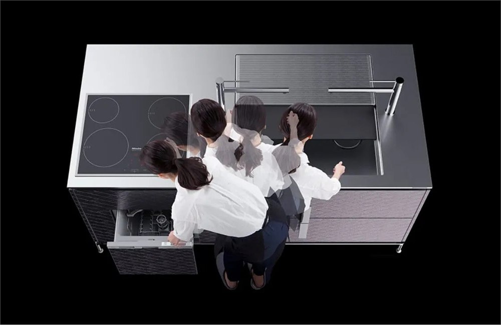 Overhead view of people using the CORE kitchen Parallelo sink prep zone