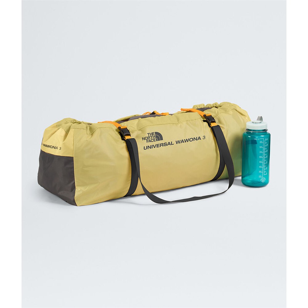 Packed Universal Wawona 3 tent beside a water bottle for scale