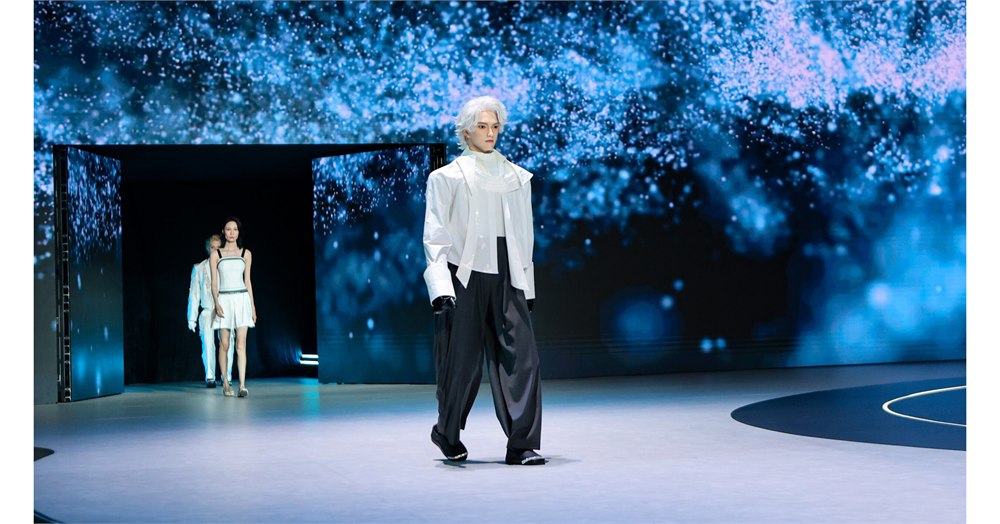 UWORLD U1 humanoid robot walking on a blue-lit launch stage