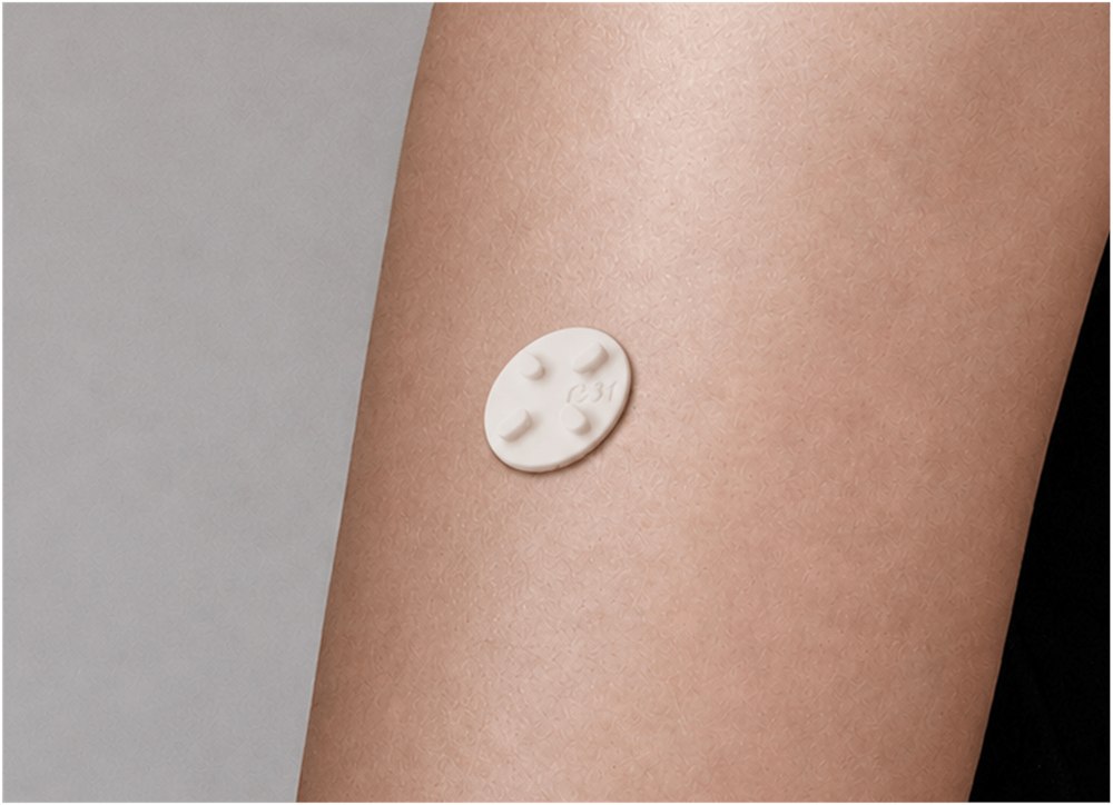 A Microdot Tattoo patch resting on skin during the wait step