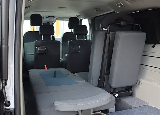 Schnierle campervan sliding seat system shown in multiple positions