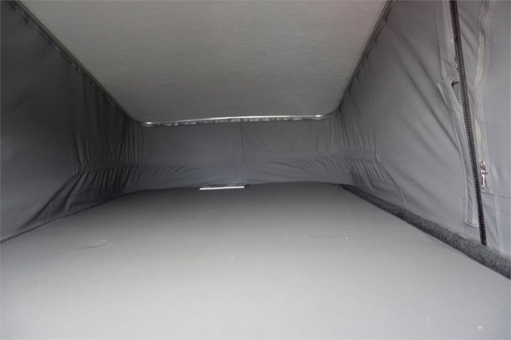Upper roof bed inside a Wellhouse pop-top campervan conversion