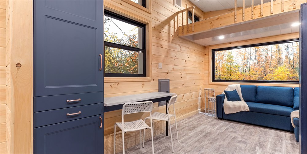 White Pine tiny house dining area and living room with large windows