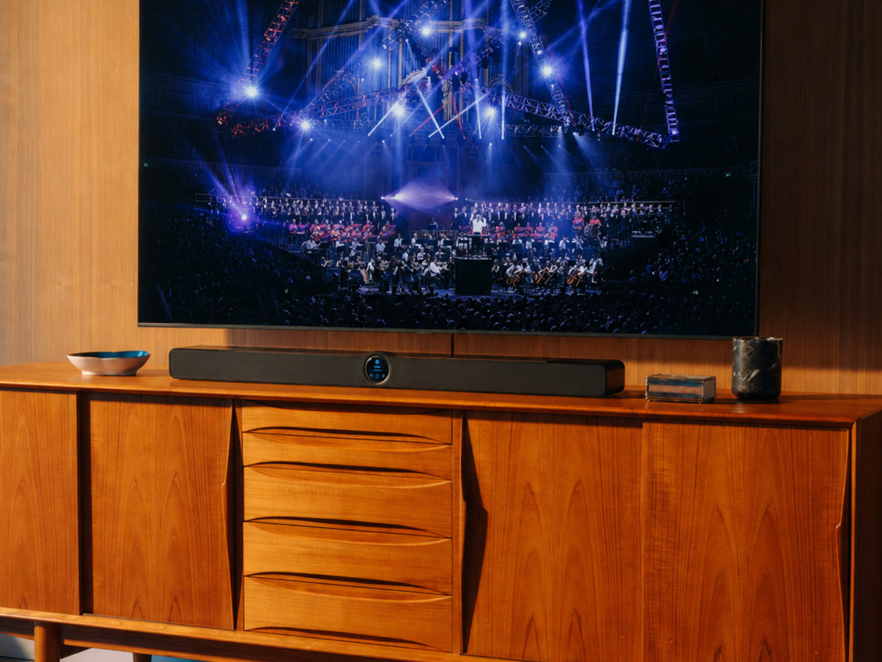 WiiM Bar black soundbar showing glossy top and fabric front
