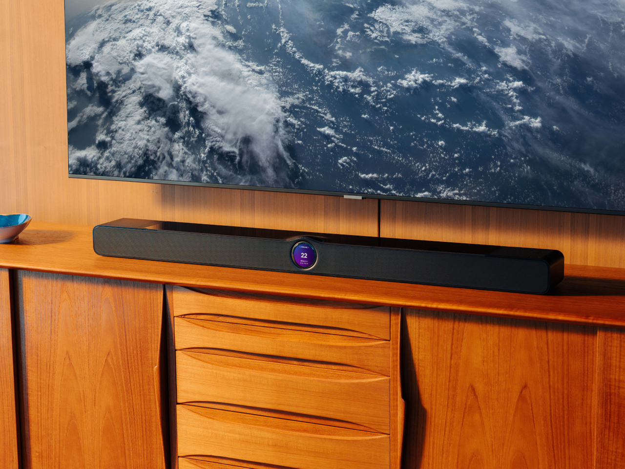 WiiM Bar soundbar with circular display below a TV