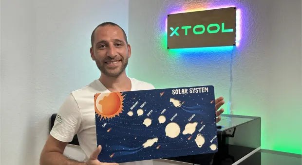 xTool O1 Omni printer with a printed rigid panel sample