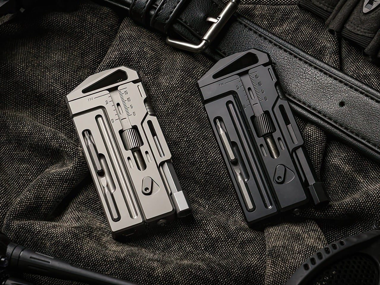 Silver and dark titanium multitool wrench versions on fabric