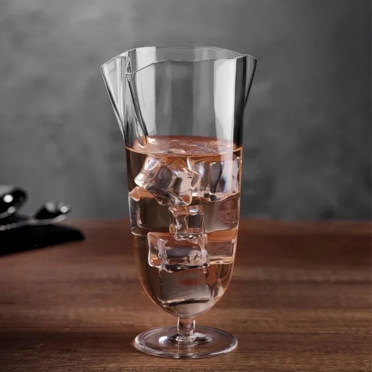 Double pour mixing glass filled with ice and a drink