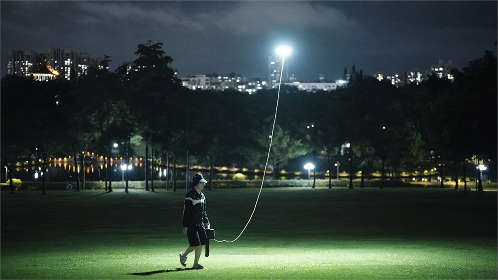 HEONE-X ground power station with the tethered light following overhead
