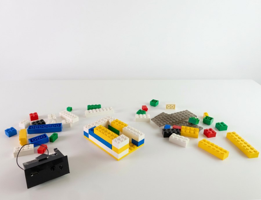 Audio Bricks electronic and adapter components laid out on a work table