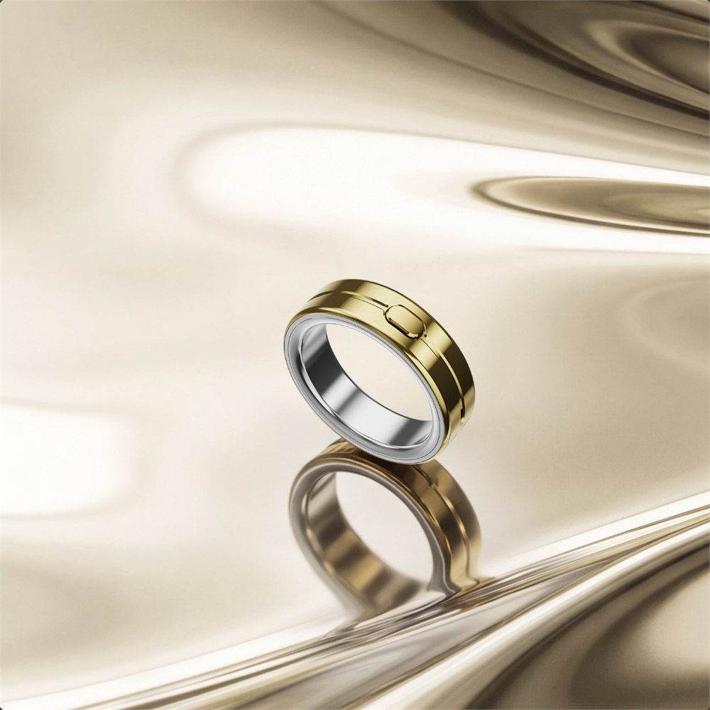 Gold Vocci Ring on a polished background