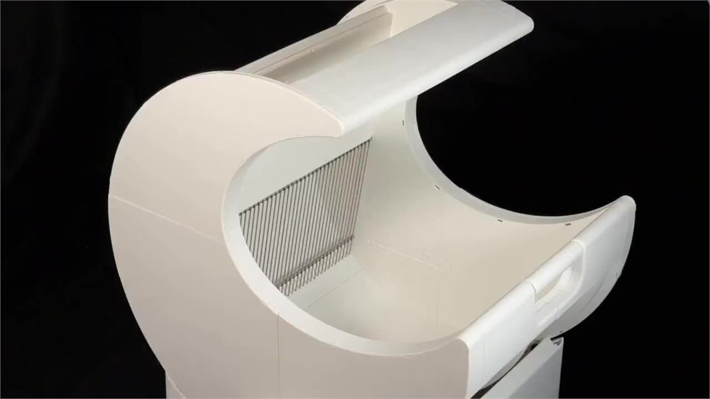 MoonBox open crescent-shaped litter box showing the manual spin design