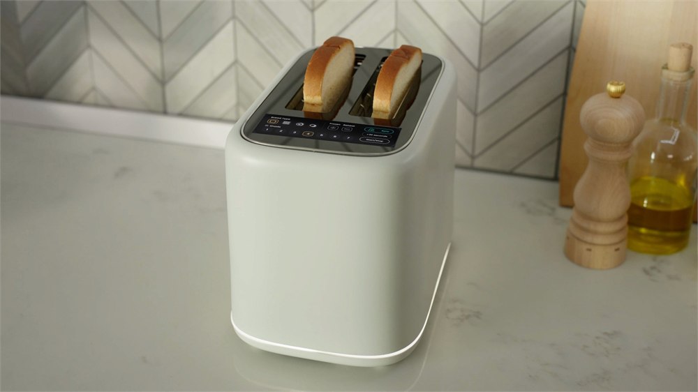 CHEFFY T.O.A.S.T.R. toaster with bread slices on a kitchen counter