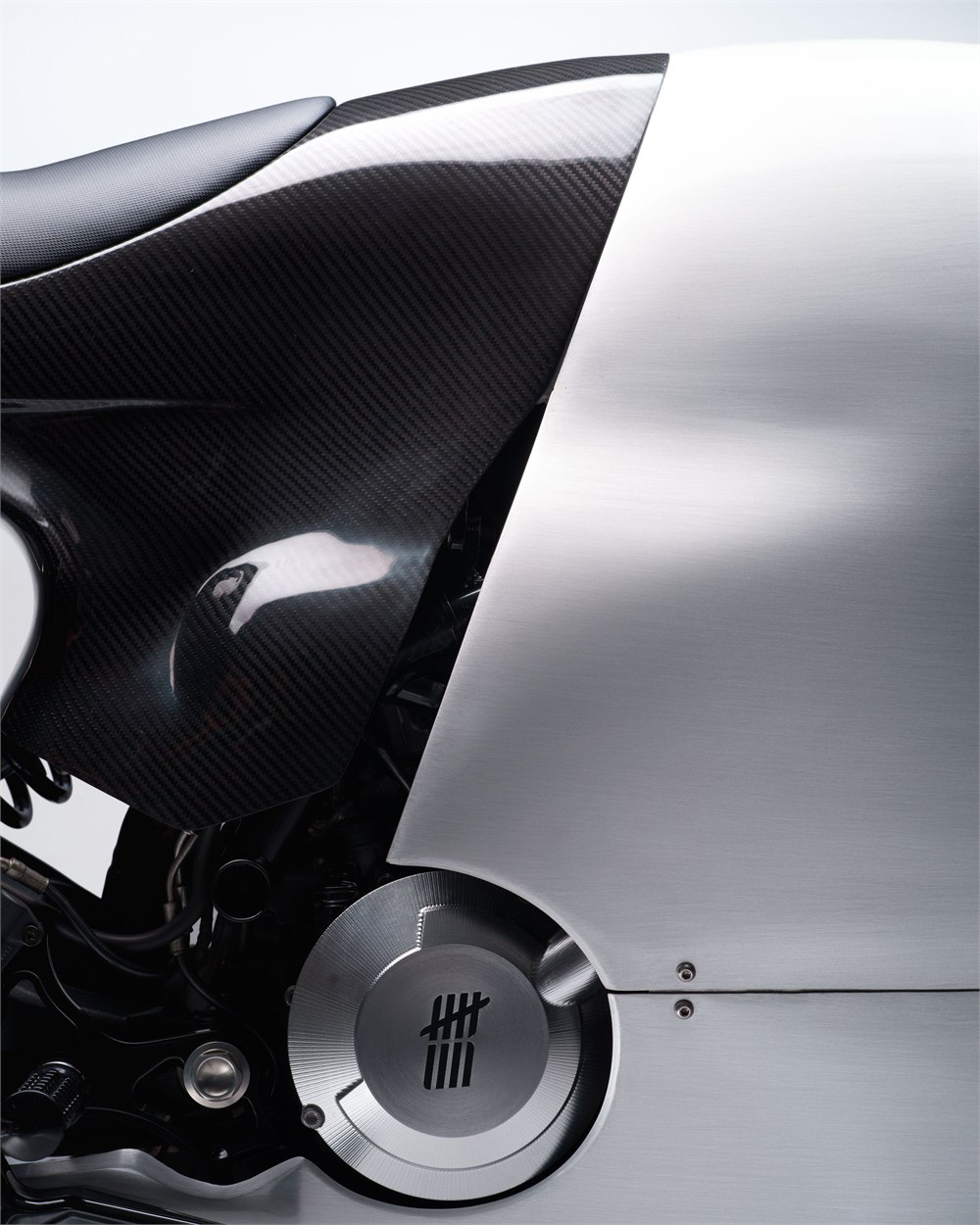 Close-up of carbon fiber and brushed aluminum surfaces on the Bandit9 Ducati 821