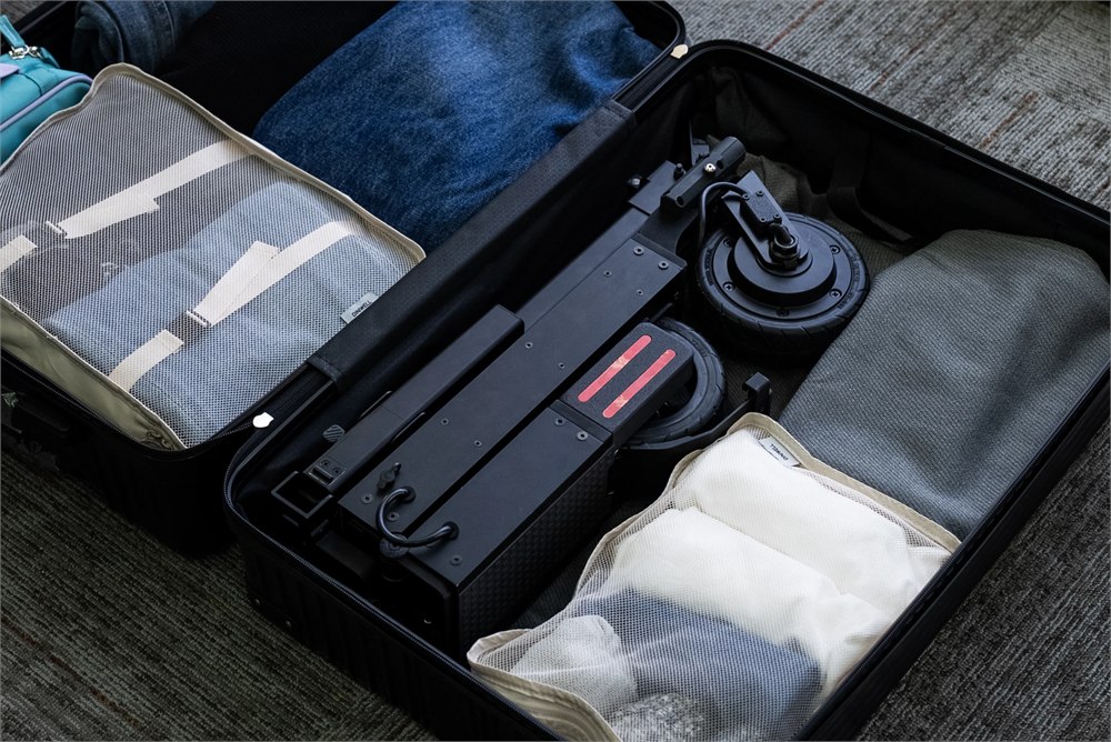 Blizwheel F0.5 folded inside a suitcase for travel storage