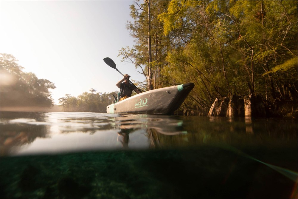 BOTE LONO Aero inflatable kayak paddling on clear water