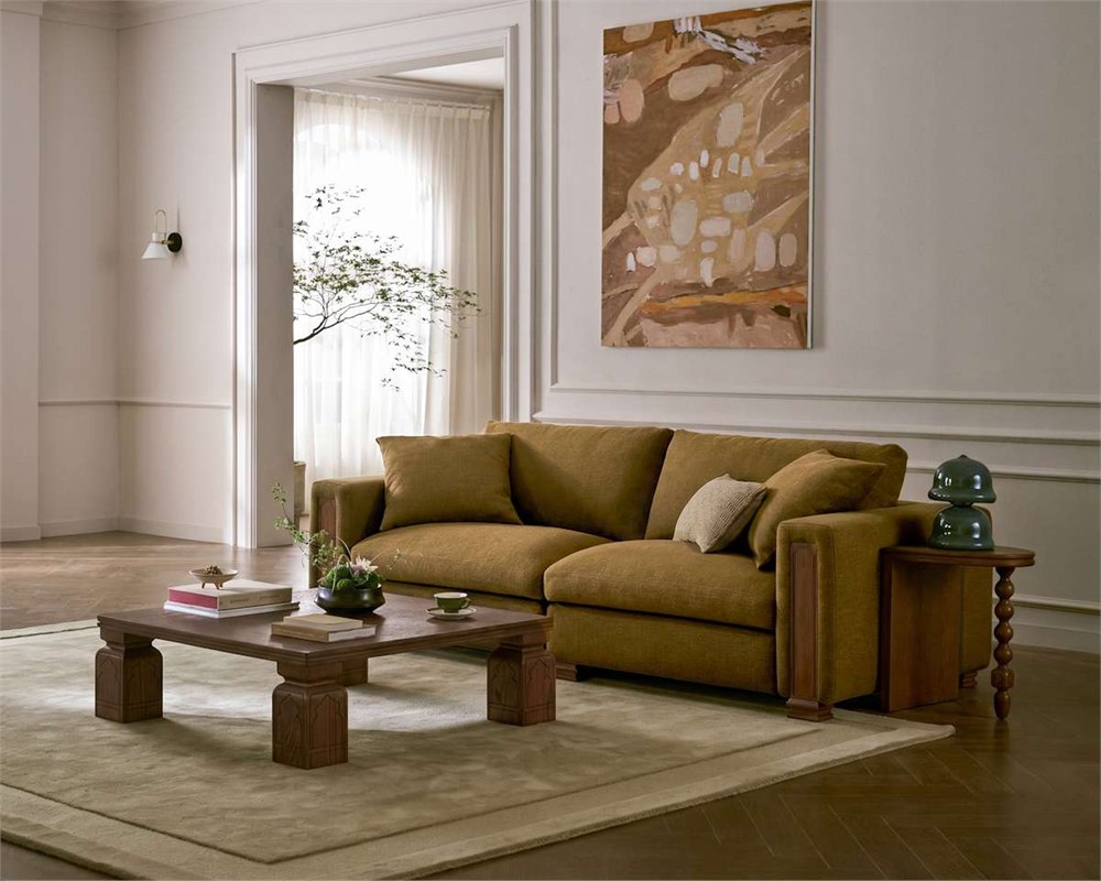Tan France Kagan 3 Seater Sofa styled in a living room with matching wood furniture