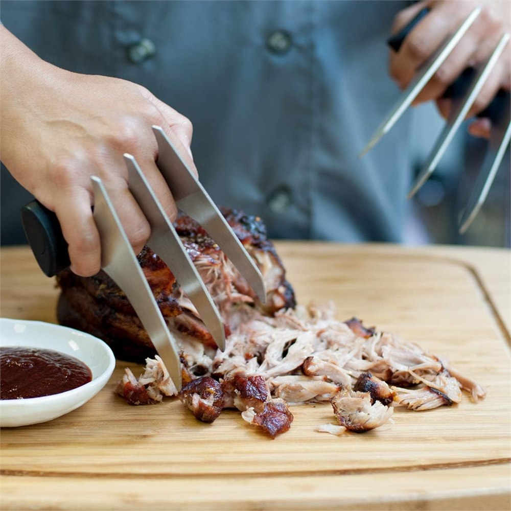 Close view of stainless steel meat shredder claws for roasts and pulled pork