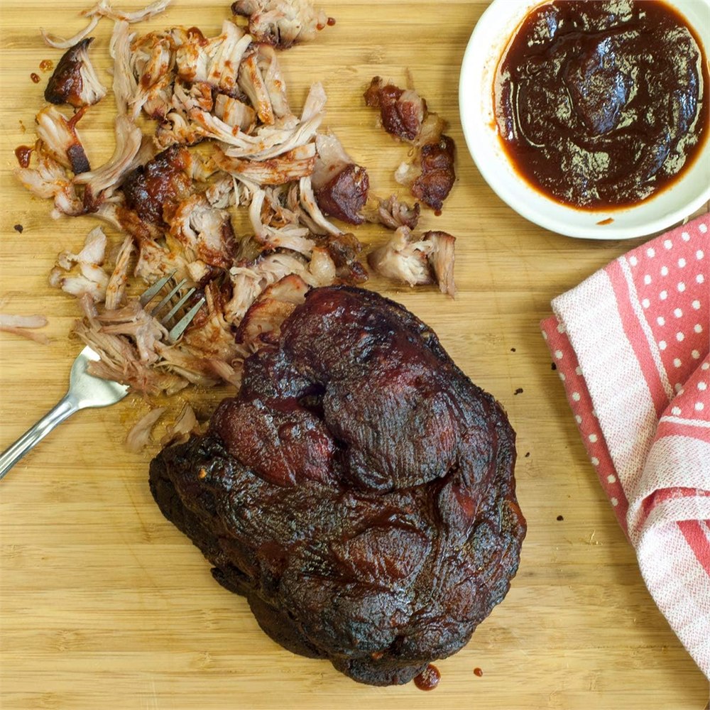 Stainless steel meat claws shown with barbecue food prep details