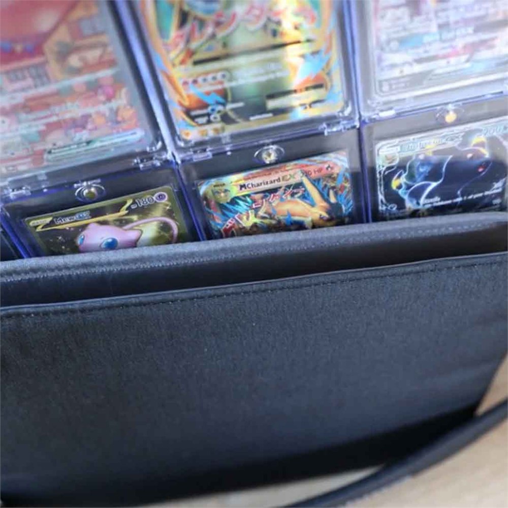 Protected trading cards displayed in Collectorium card cases inside the system