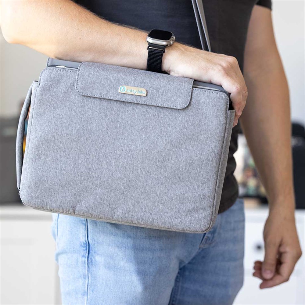 Collectorium Vault worn as a gray crossbody collection carry case