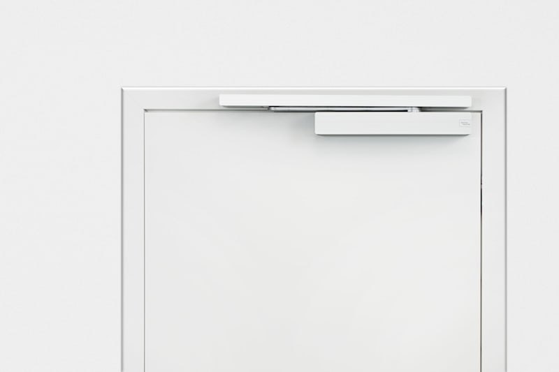 EasyAssist operator installed on a door leaf in a clean interior space