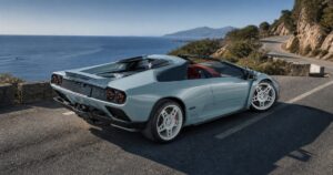Eccentrica V12 Roadster open-top Diablo restomod on a coastal road