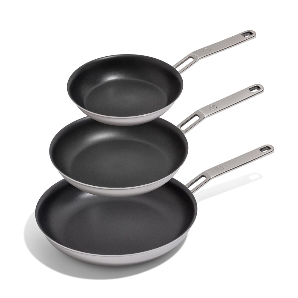 Three BARE Cookware Everpan frying pan sizes stacked together