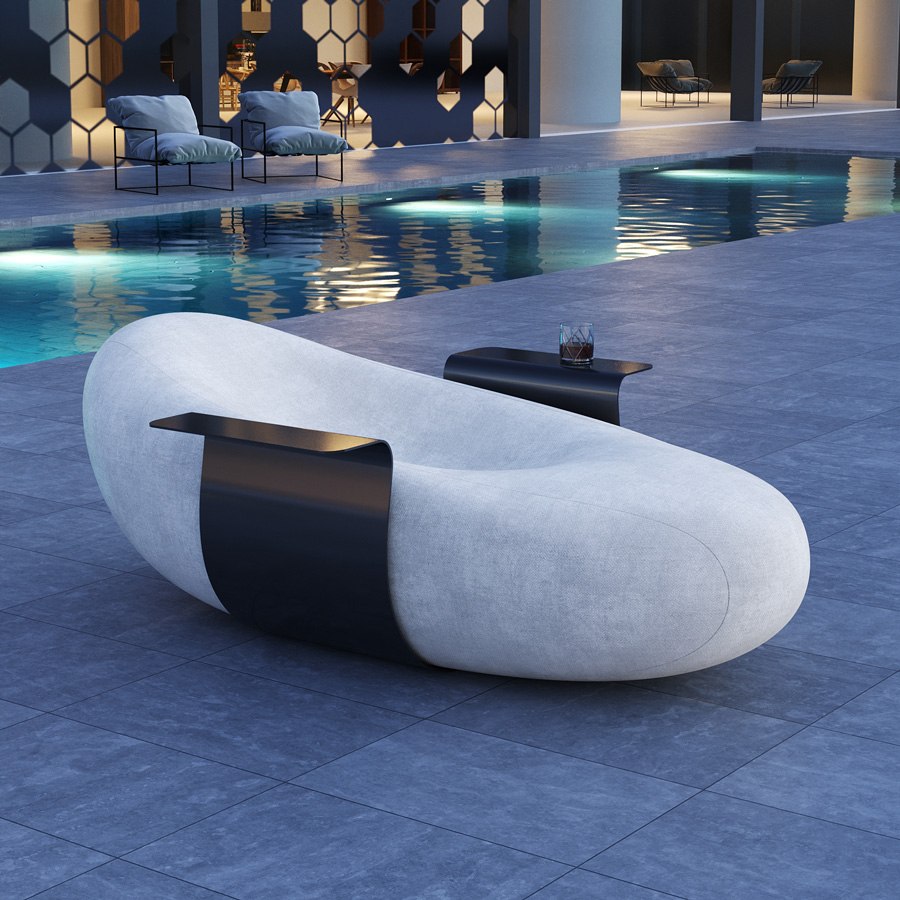 Mavimatt Fagiolo sculptural lounge chair beside a pool