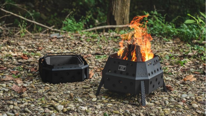 CARGO CONTAINER FIRE PIT MAX folding smokeless fire pit burning at a campsite