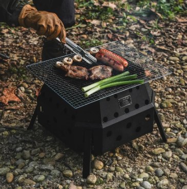 FIRE PIT MAX being used with a cooking grate over the fire pit body