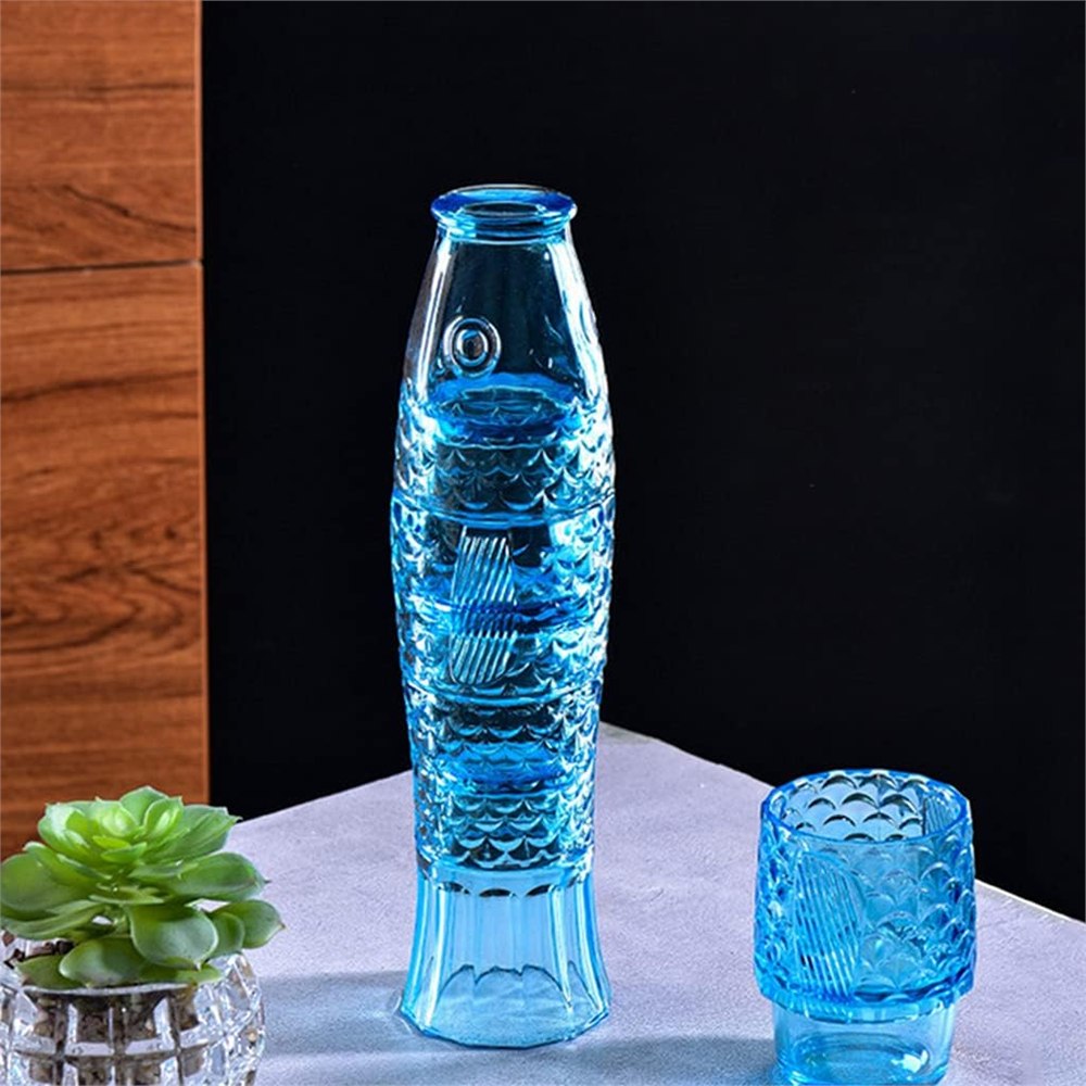 Blue fish-shaped stackable tumbler glasses displayed on a tabletop