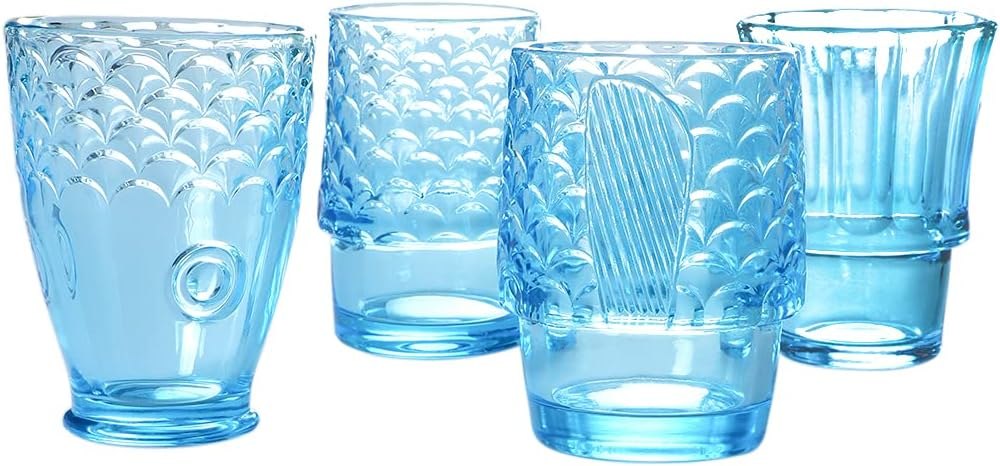Four blue textured fish design tumbler glasses shown as individual cups