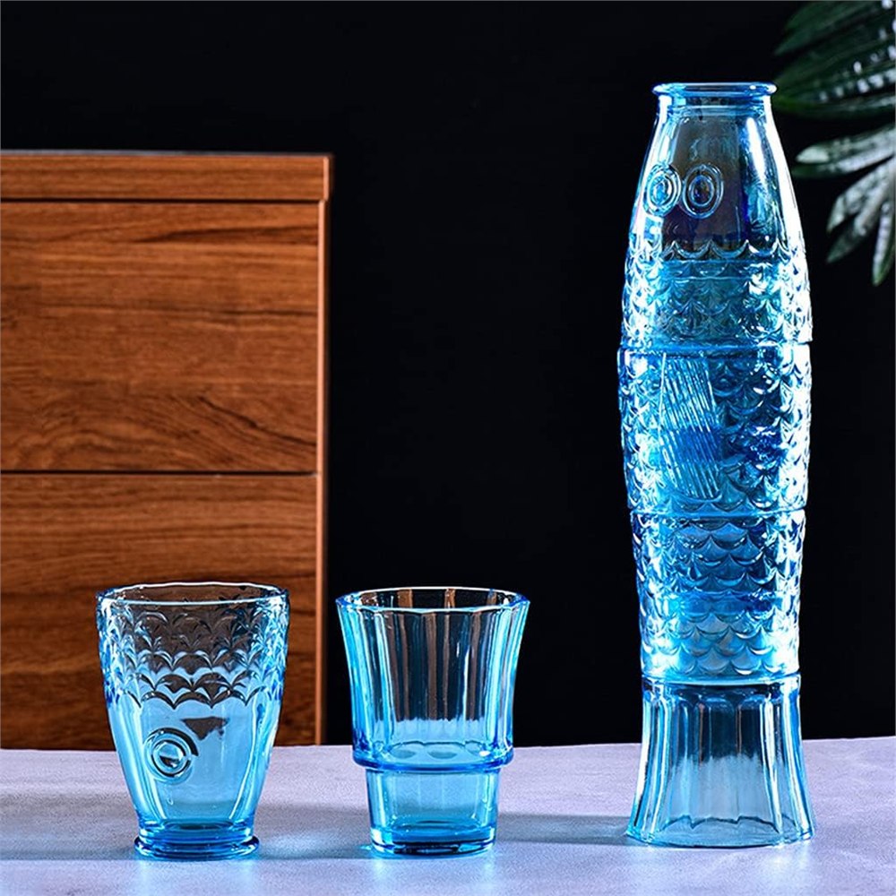 Blue fish tumbler glasses stacked and separated to show the space-saving design
