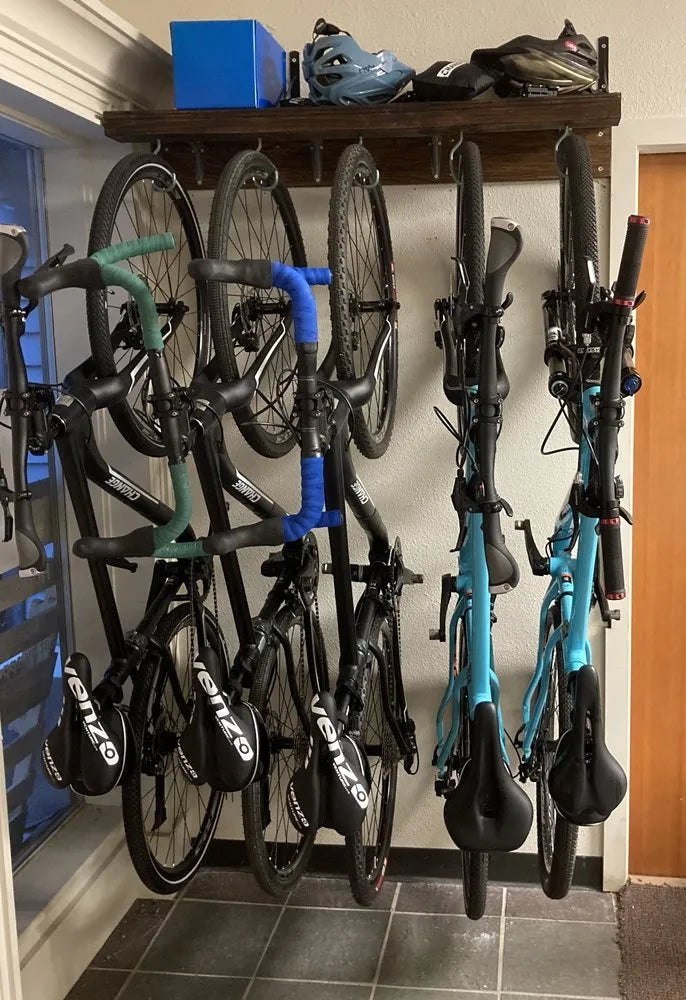 Several bicycles arranged in narrow wall storage using Flatbike hardware