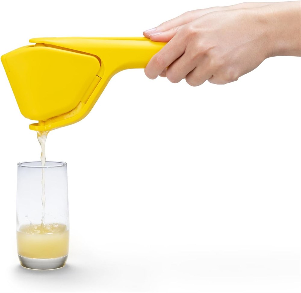 Dreamfarm Fluicer directing citrus juice into a glass