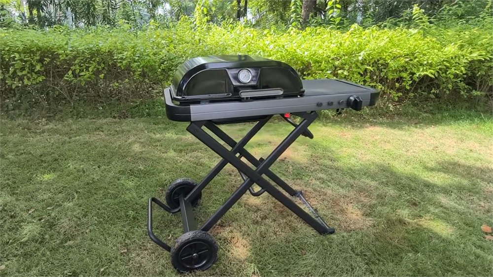 The FYREL Fold & Go outdoor kitchen unfolded on its wheeled X-frame stand.