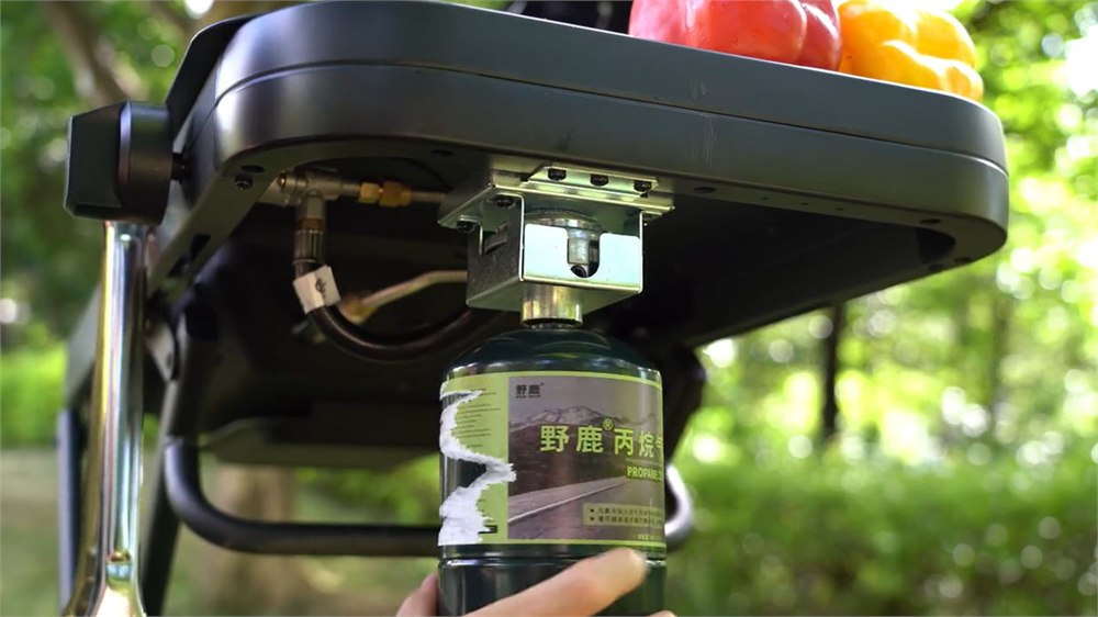 The Fold & Go outdoor kitchen can run on propane for faster campsite cooking.