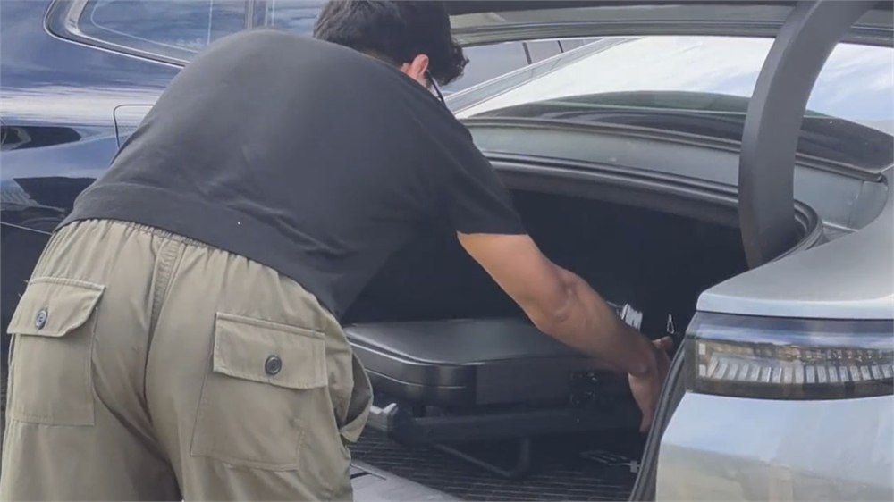 The FYREL Fold & Go packed into an SUV cargo area for transport.
