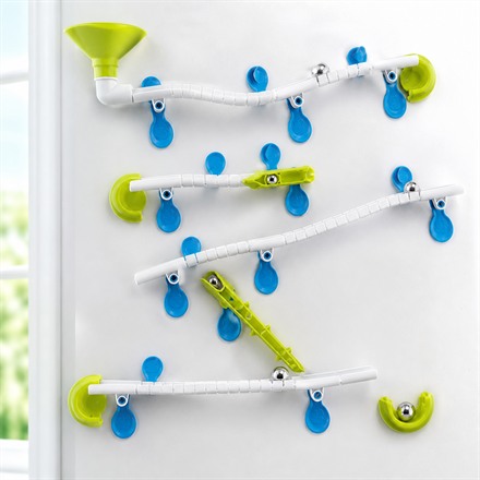 This Wall-Mounted Marble Run Turns Windows Into Vertical Race Tracks