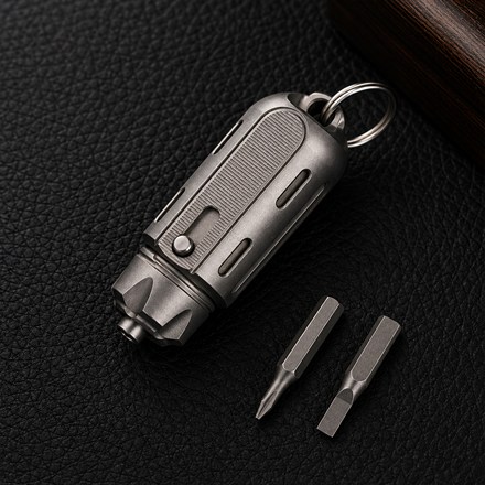 This Titanium Keyring Tool Stores Screwdriver Bits, a Pen, and a Blade