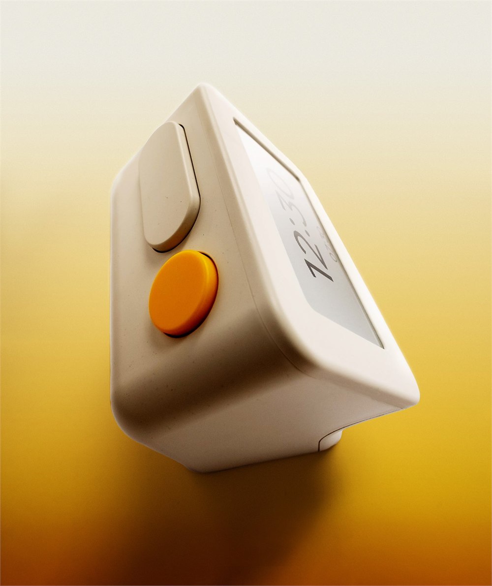 Close-up of the Habity bedside clock yellow button and slanted display